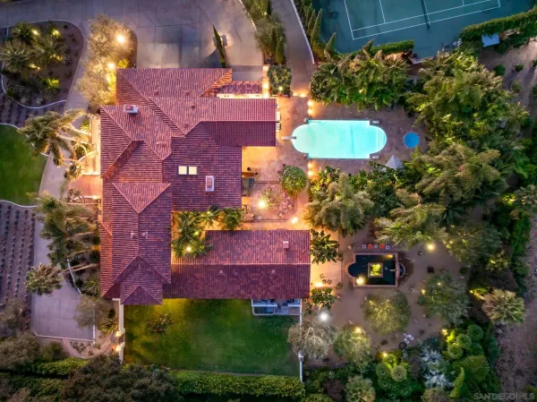 an aerial view of residential house with outdoor space and street view