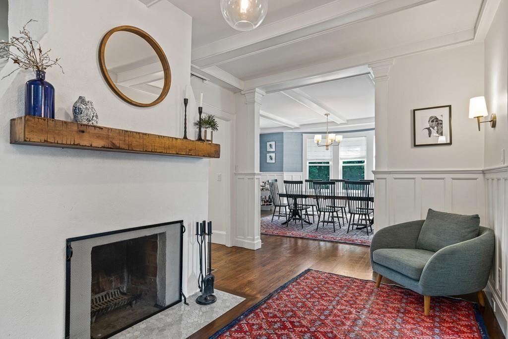 125 Walnut Street Dedham, MA 02026 - Photo 11 of 37 a living room with furniture and a fireplace