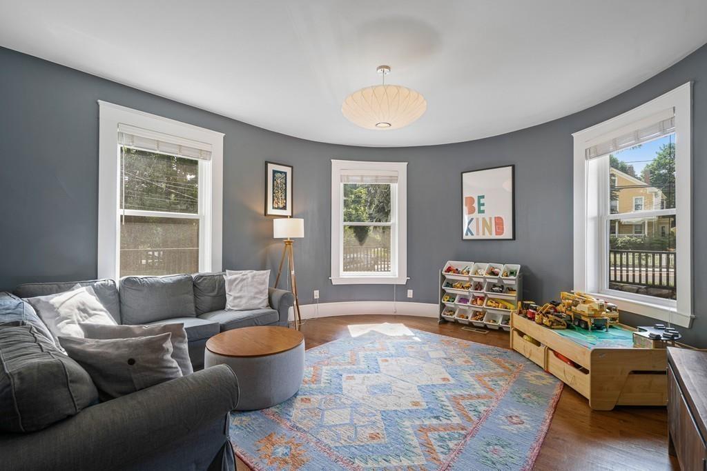 125 Walnut Street Dedham, MA 02026 - Photo 14 of 37 a living room with furniture and a large window