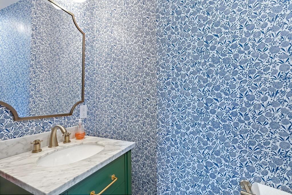 125 Walnut Street Dedham, MA 02026 - Photo 24 of 37 a bathroom with a sink and a mirror