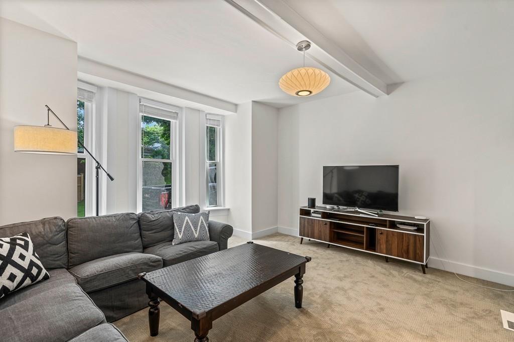 125 Walnut Street Dedham, MA 02026 - Photo 27 of 37 a living room with furniture and a flat screen tv