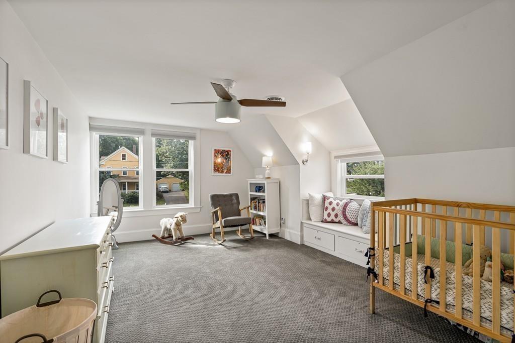 125 Walnut Street Dedham, MA 02026 - Photo 6 of 37 a living room with furniture and a large window