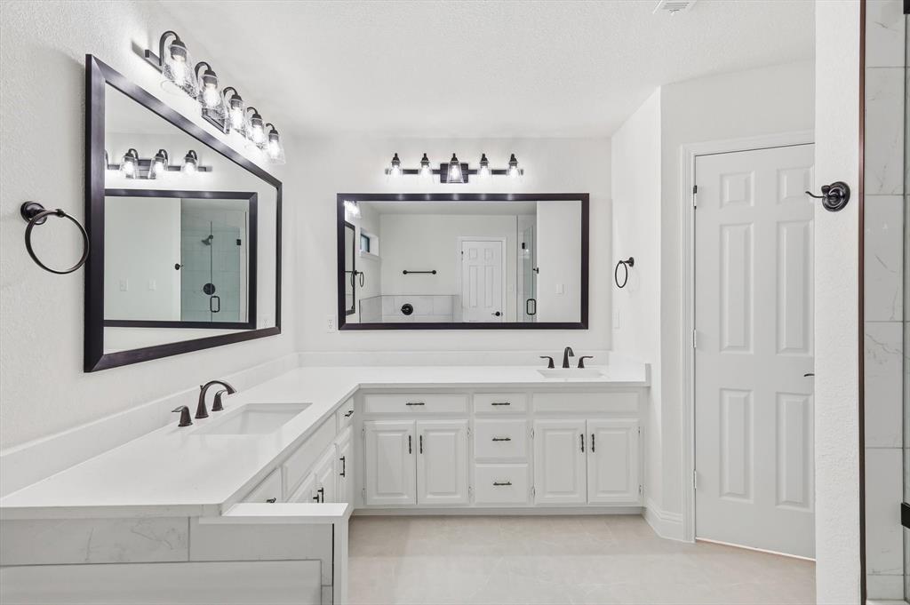 19 Timbergreen Circle Denton, TX 76205 - Photo 19 of 40 a bathroom with a double vanity sink mirror and