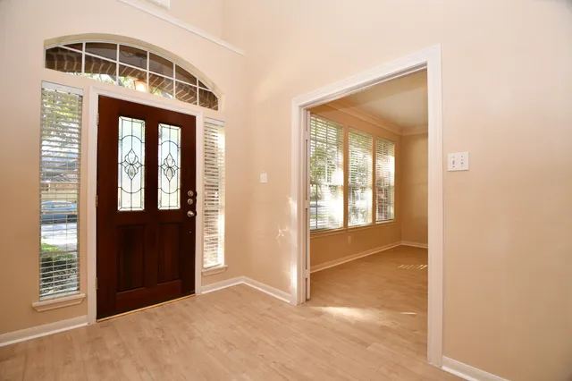 a view of entryway with wooden floor