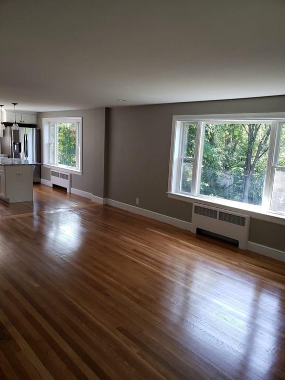 198 Lebanon Hill Road Southbridge, MA 01550 - Photo 17 of 37 an empty room with wooden floor and windows