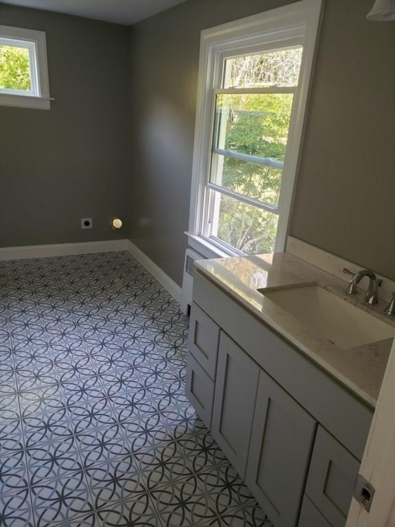 198 Lebanon Hill Road Southbridge, MA 01550 - Photo 18 of 37 a bathroom with a sink a vanity and a window