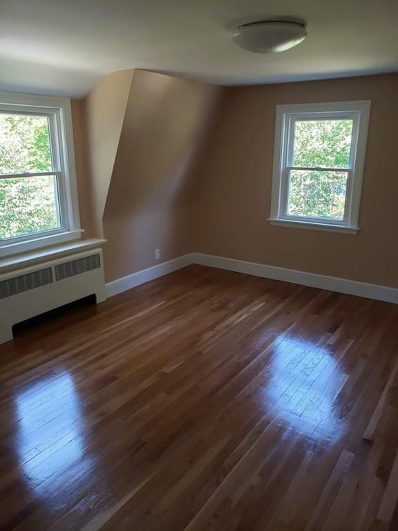 198 Lebanon Hill Road Southbridge, MA 01550 - Photo 25 of 37 an empty room with wooden floor and windows