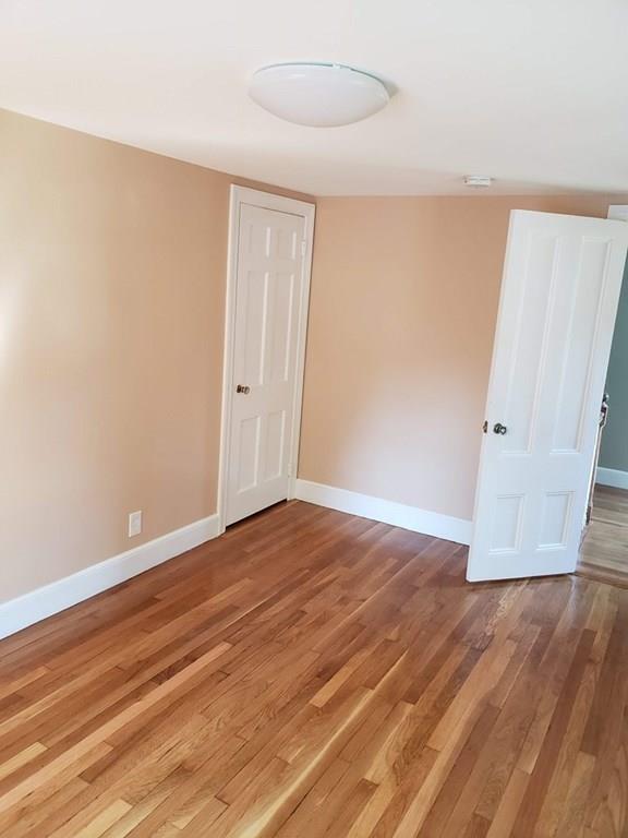 198 Lebanon Hill Road Southbridge, MA 01550 - Photo 26 of 37 a view of an empty room with wooden floor and a window