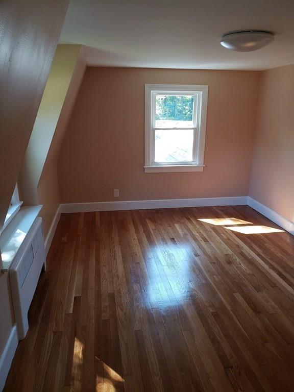 198 Lebanon Hill Road Southbridge, MA 01550 - Photo 30 of 37 an empty room with wooden floor and windows