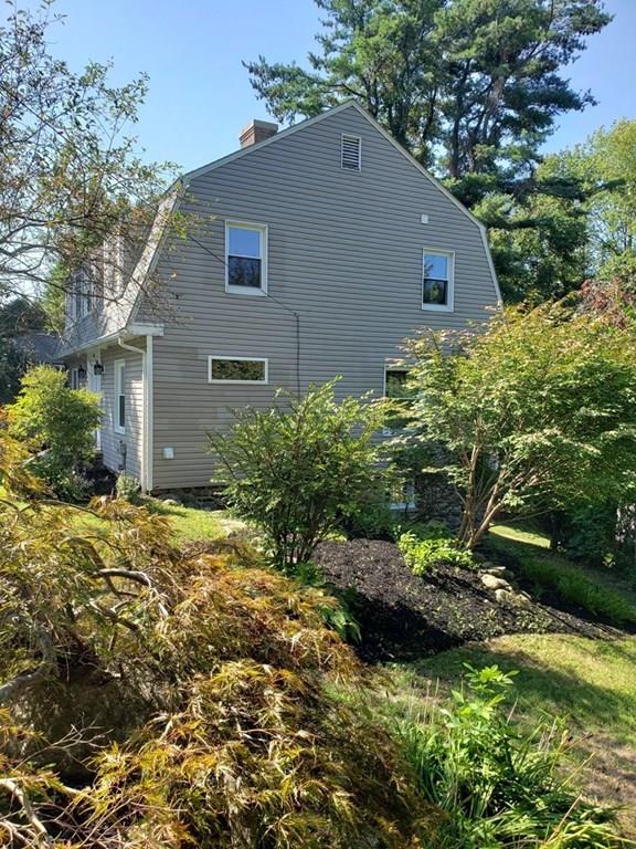 198 Lebanon Hill Road Southbridge, MA 01550 - Photo 3 of 37 a view of a backyard with plants and a large tree