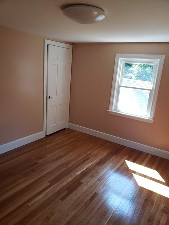 198 Lebanon Hill Road Southbridge, MA 01550 - Photo 32 of 37 a view of an empty room with wooden floor and a window