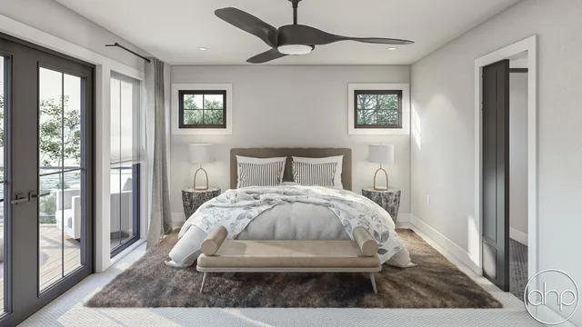 a bed sitting in a bedroom next to a window