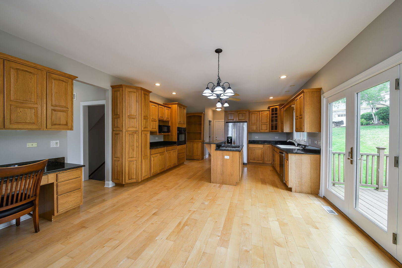104 Bruell Street Yorkville, IL 60560 - Photo 13 of 35 a view of a kitchen with refrigerator and cabinets