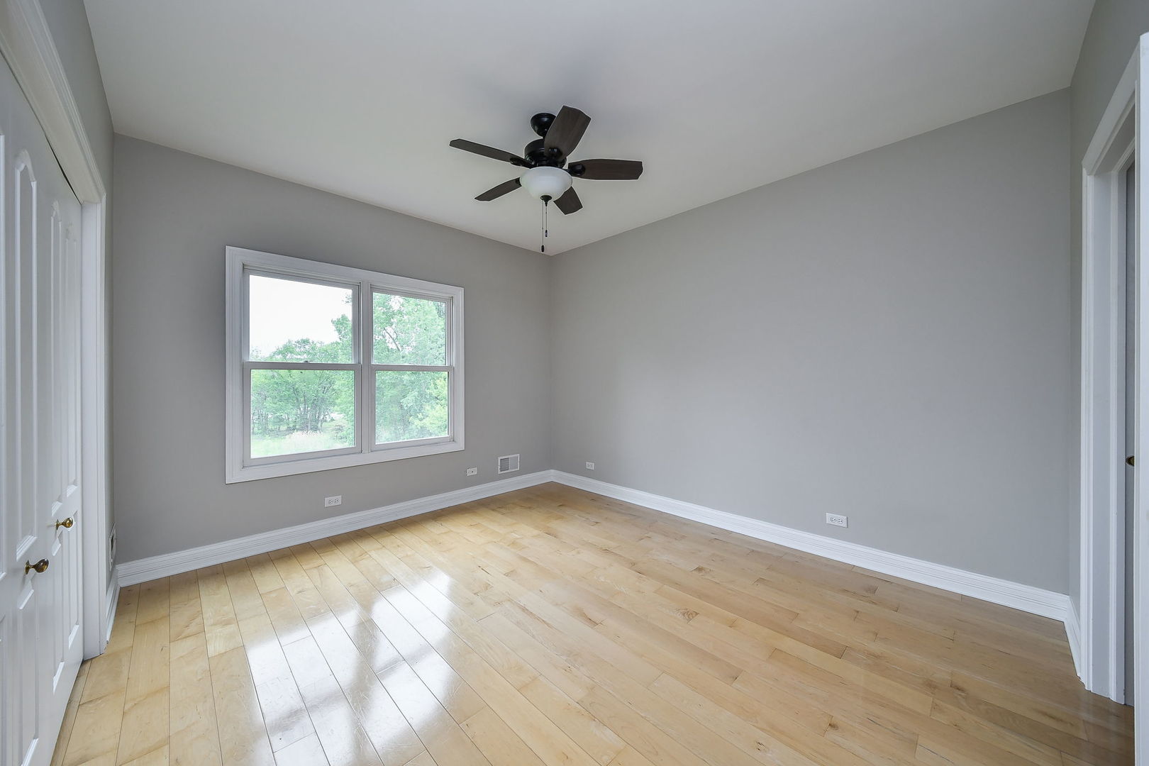 104 Bruell Street Yorkville, IL 60560 - Photo 25 of 35 an empty room with a window and a ceiling fan