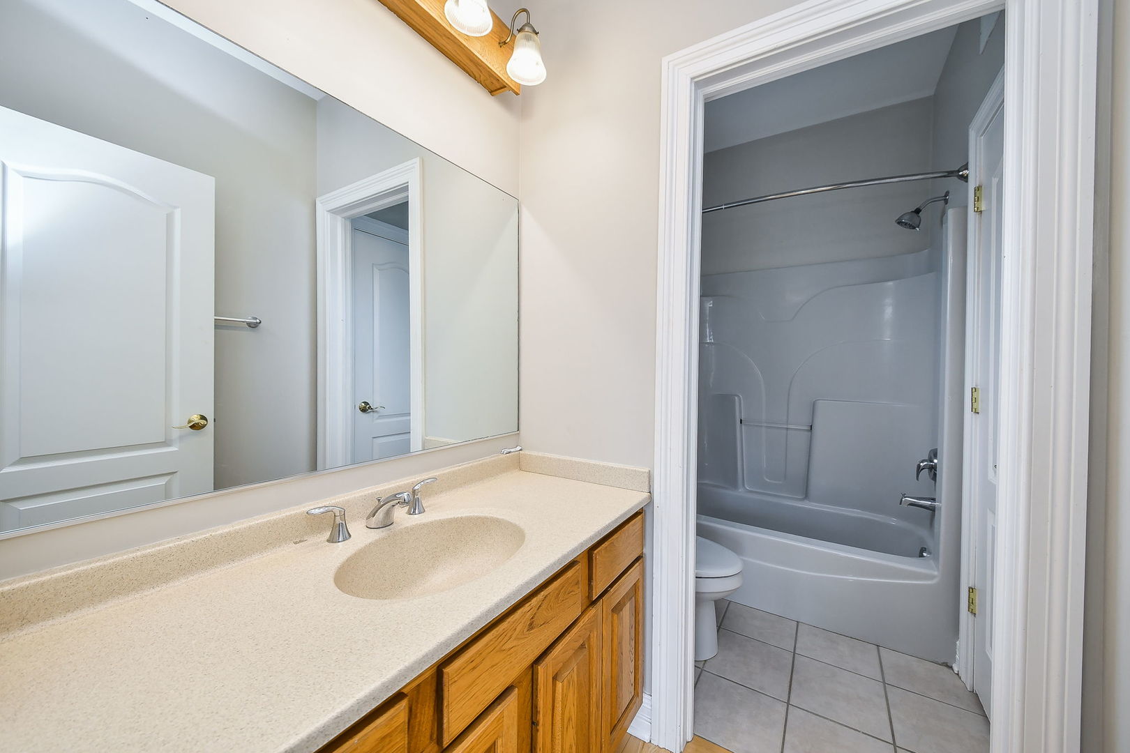 104 Bruell Street Yorkville, IL 60560 - Photo 28 of 35 a bathroom with a sink and a mirror