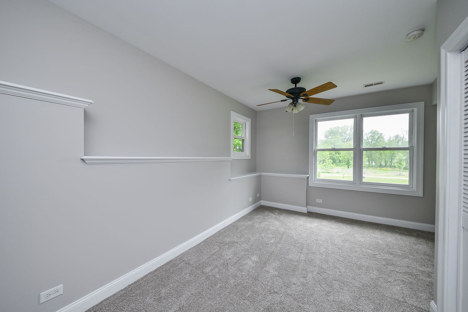 104 Bruell Street Yorkville, IL 60560 - Photo 33 of 35 an empty room with a window and a ceiling fan