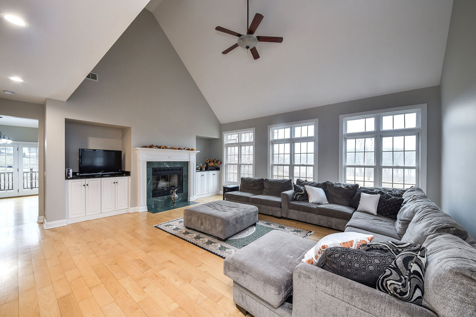 104 Bruell Street Yorkville, IL 60560 - Photo 5 of 35 a living room with furniture fireplace and flat screen tv
