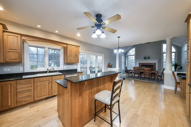 a large kitchen with a table and chairs in it