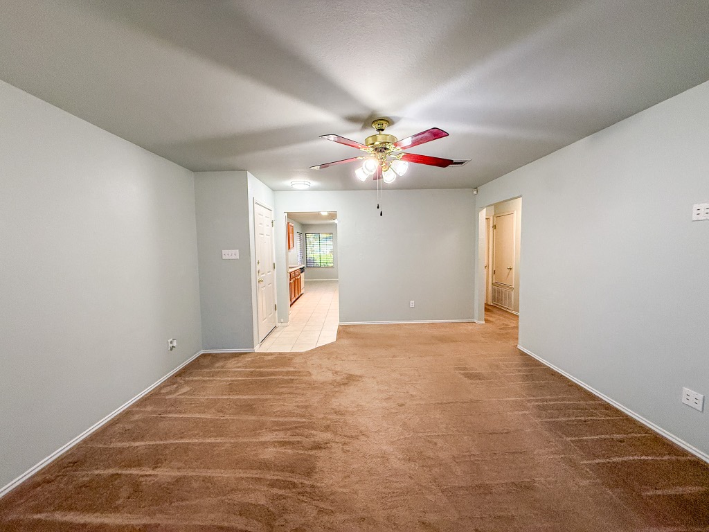 11101 Franklins Tale Loop Austin, TX 78748 - Photo 15 of 39 Spare room featuring light colored carpet and a ceiling fan