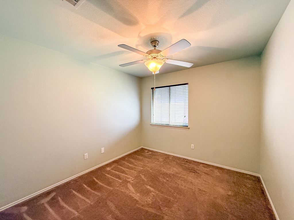 11101 Franklins Tale Loop Austin, TX 78748 - Photo 31 of 38 Carpeted spare room with baseboards