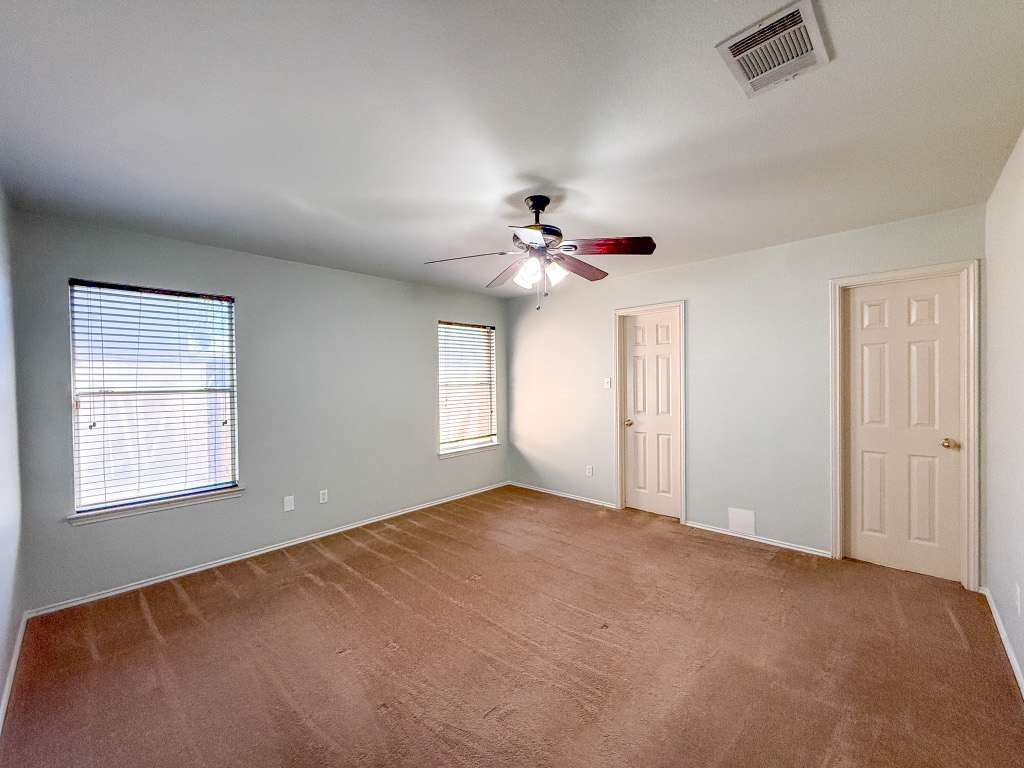 11101 Franklins Tale Loop Austin, TX 78748 - Photo 34 of 38 Unfurnished bedroom with ceiling fan and carpet flooring