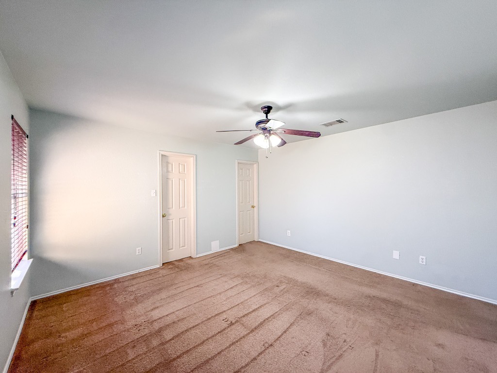 11101 Franklins Tale Loop Austin, TX 78748 - Photo 35 of 38 Unfurnished bedroom featuring a ceiling fan and carpet flooring