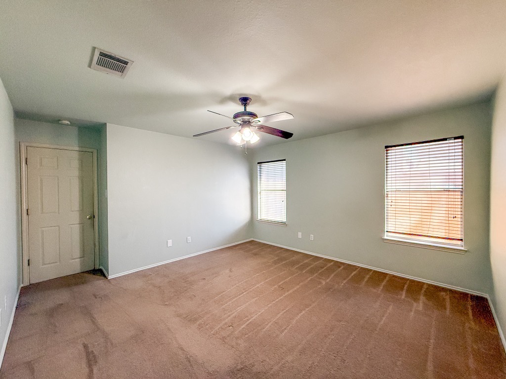 11101 Franklins Tale Loop Austin, TX 78748 - Photo 37 of 38 Carpeted empty room featuring baseboards and a ceiling fan