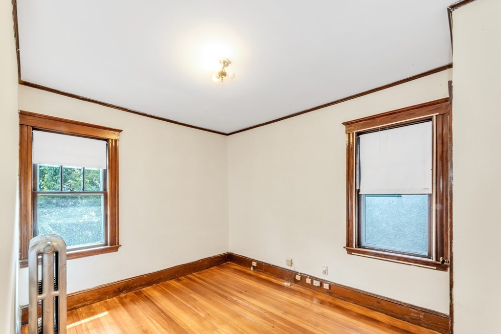 115 Sumner Road Brookline, MA 02445 - Photo 18 of 25 a view of an empty room with a window