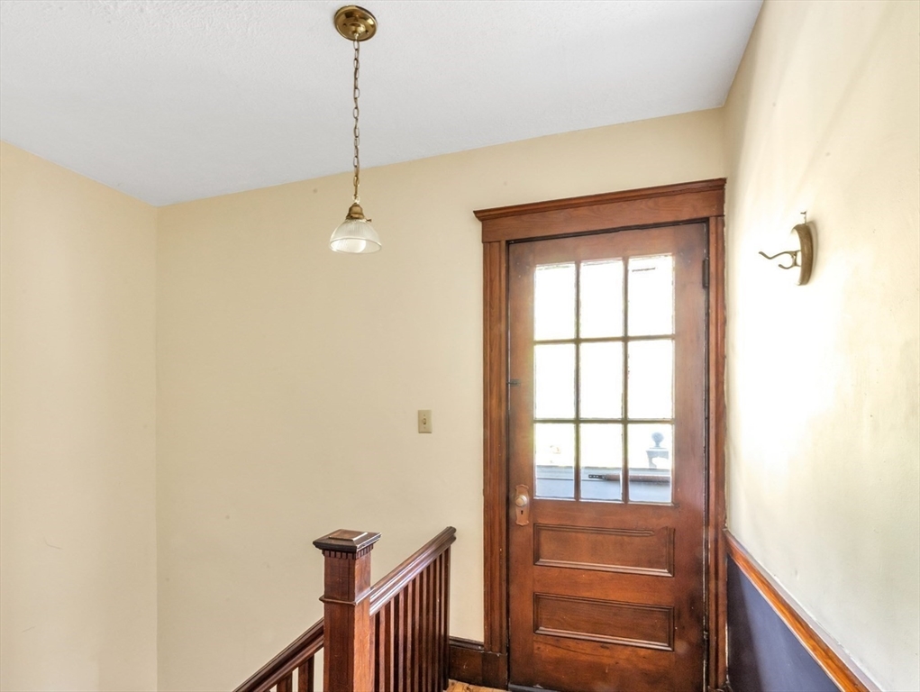 115 Sumner Road Brookline, MA 02445 - Photo 22 of 25 a view of a hallway with windows