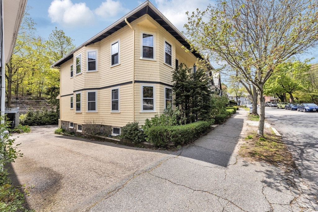 115 Sumner Road Brookline, MA 02445 - Photo 23 of 25 a front view of a house with a yard