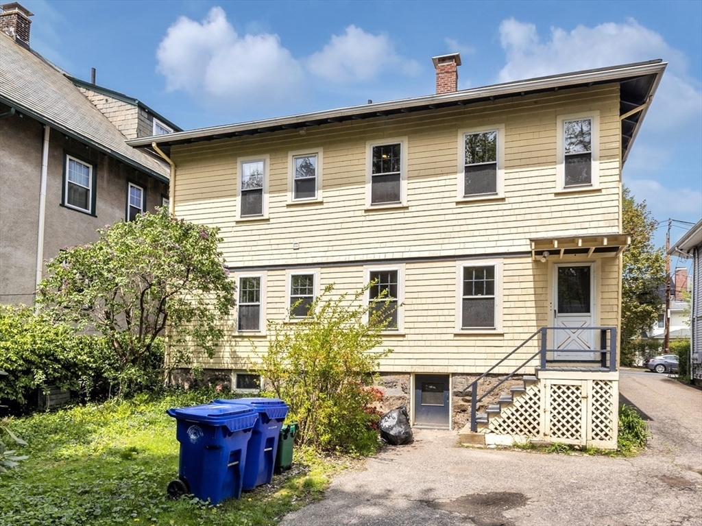 115 Sumner Road Brookline, MA 02445 - Photo 24 of 25 a front view of a house with garden