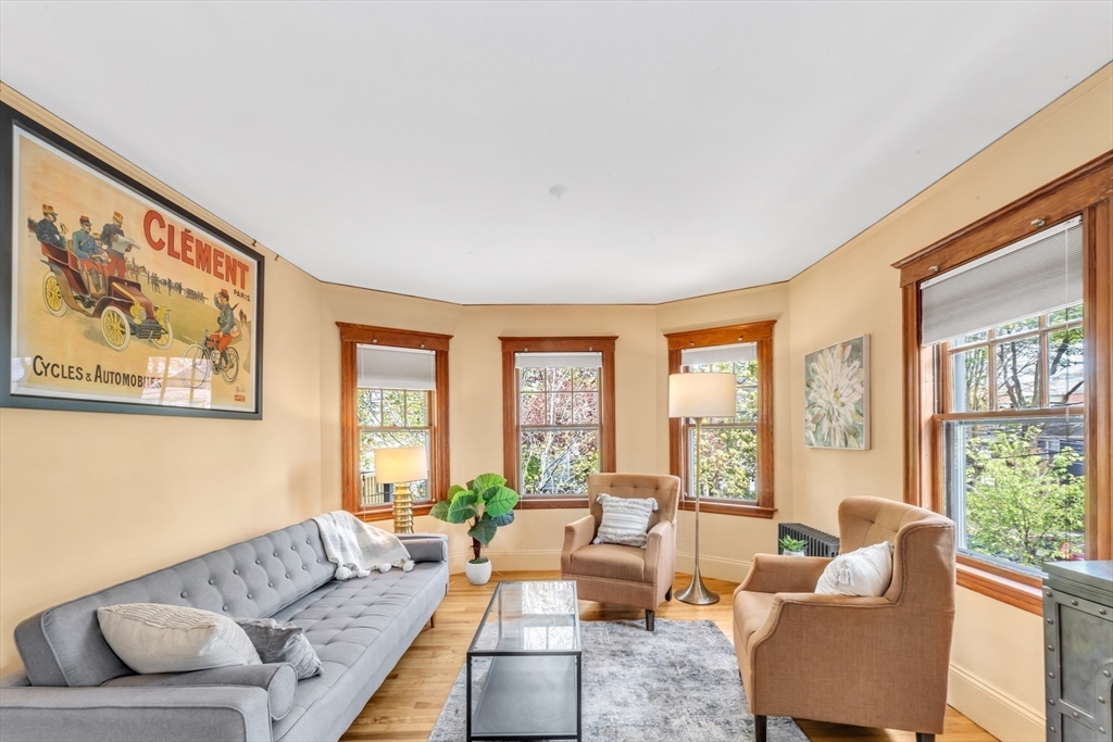 115 Sumner Road Brookline, MA 02445 - Photo 5 of 25 a living room with furniture and a large window