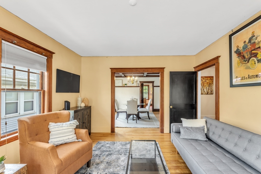 115 Sumner Road Brookline, MA 02445 - Photo 6 of 25 a living room with furniture and a flat screen tv
