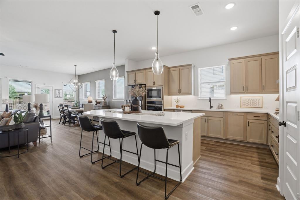 1632 Cotton Road Van Alstyne, TX 75495 - Photo 40 of 40 a kitchen with stainless steel appliances granite countertop counter space a sink and a living room view