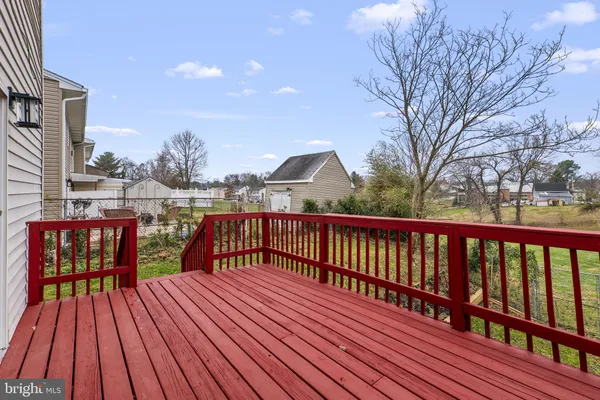 a view of balcony with wooden floor and outdoor seating