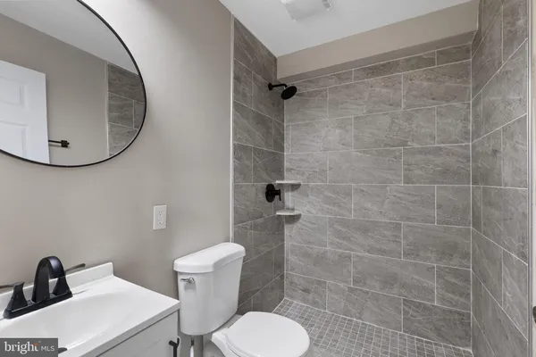 a bathroom with a toilet and a sink