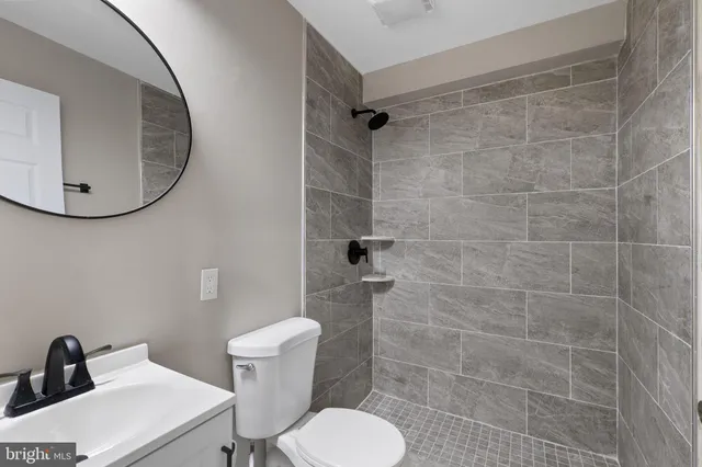 a bathroom with a toilet and a sink