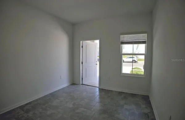 an empty room with windows