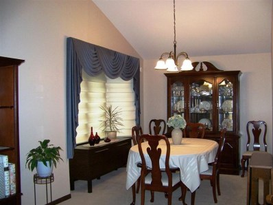 5046 89th Place Crown Point, IN 46307 - Photo 5 of 10 a dining room with furniture and window
