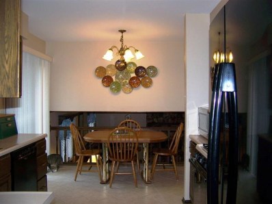 5046 89th Place Crown Point, IN 46307 - Photo 8 of 10 a view of a dining room with furniture and chandelier