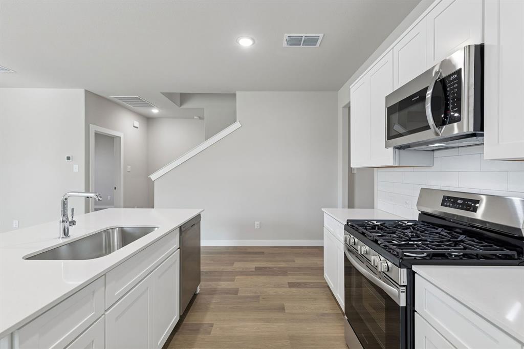 9648 Rango Road Fort Worth, TX 76123 - Photo 9 of 39 Kitchen in the Holden home plan by Trophy Signature Homes – REPRESENTATIVE PHOTO