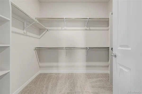a view of an empty walk in closet