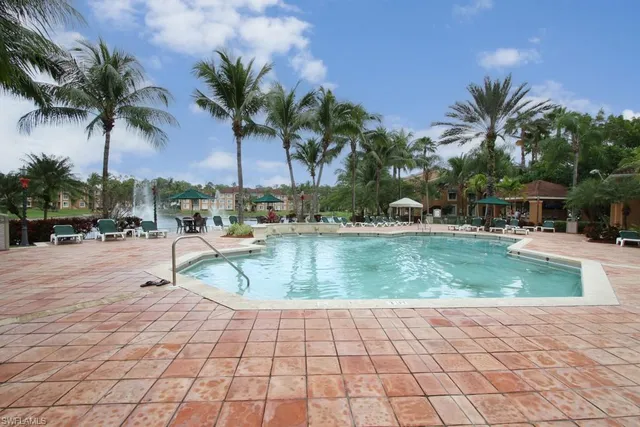 a view of outdoor space with swimming pool and patio