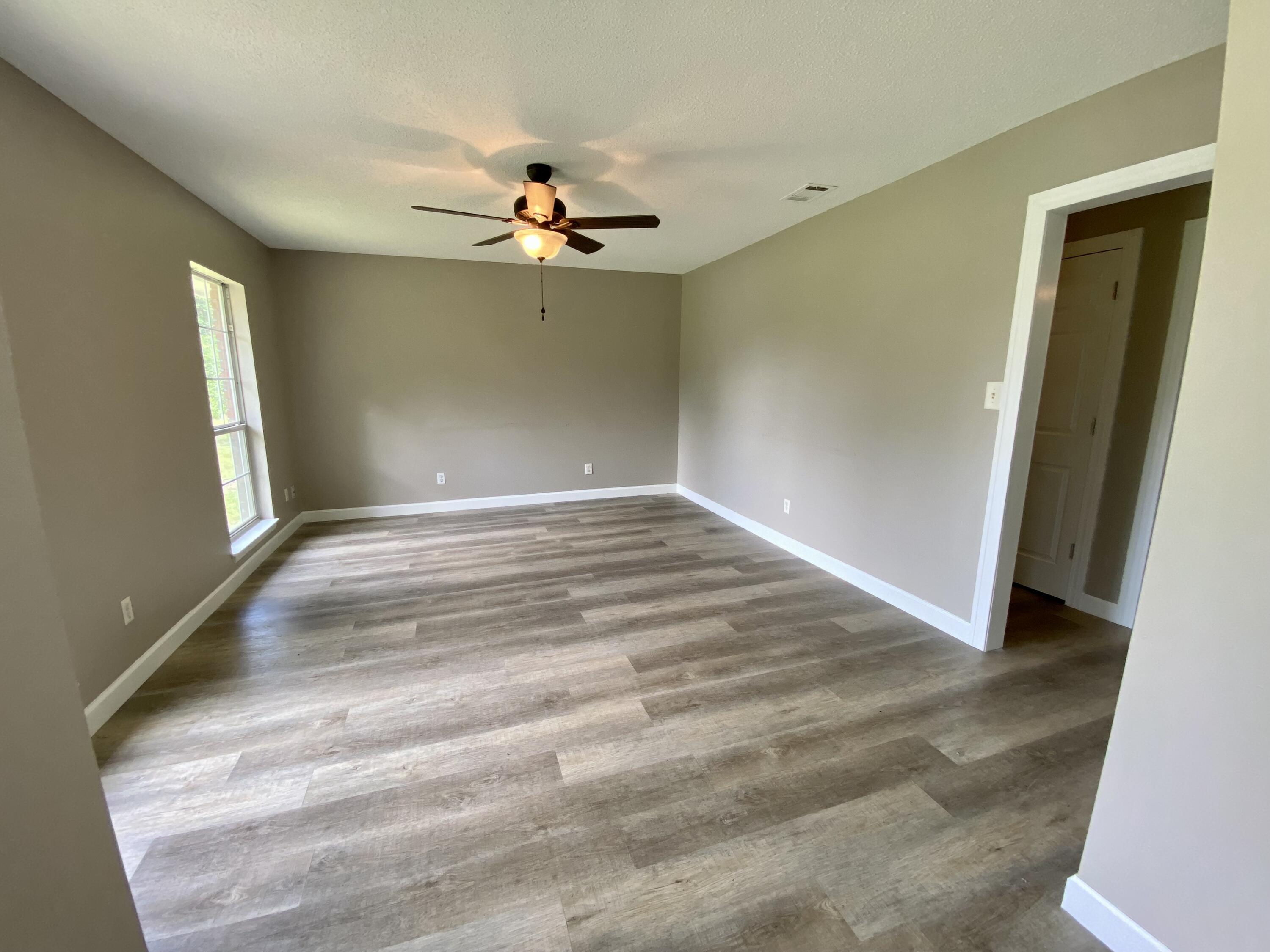 3517 Auburn Road Crestview, FL 32539 - Photo 3 of 22 a view of an empty room with a window