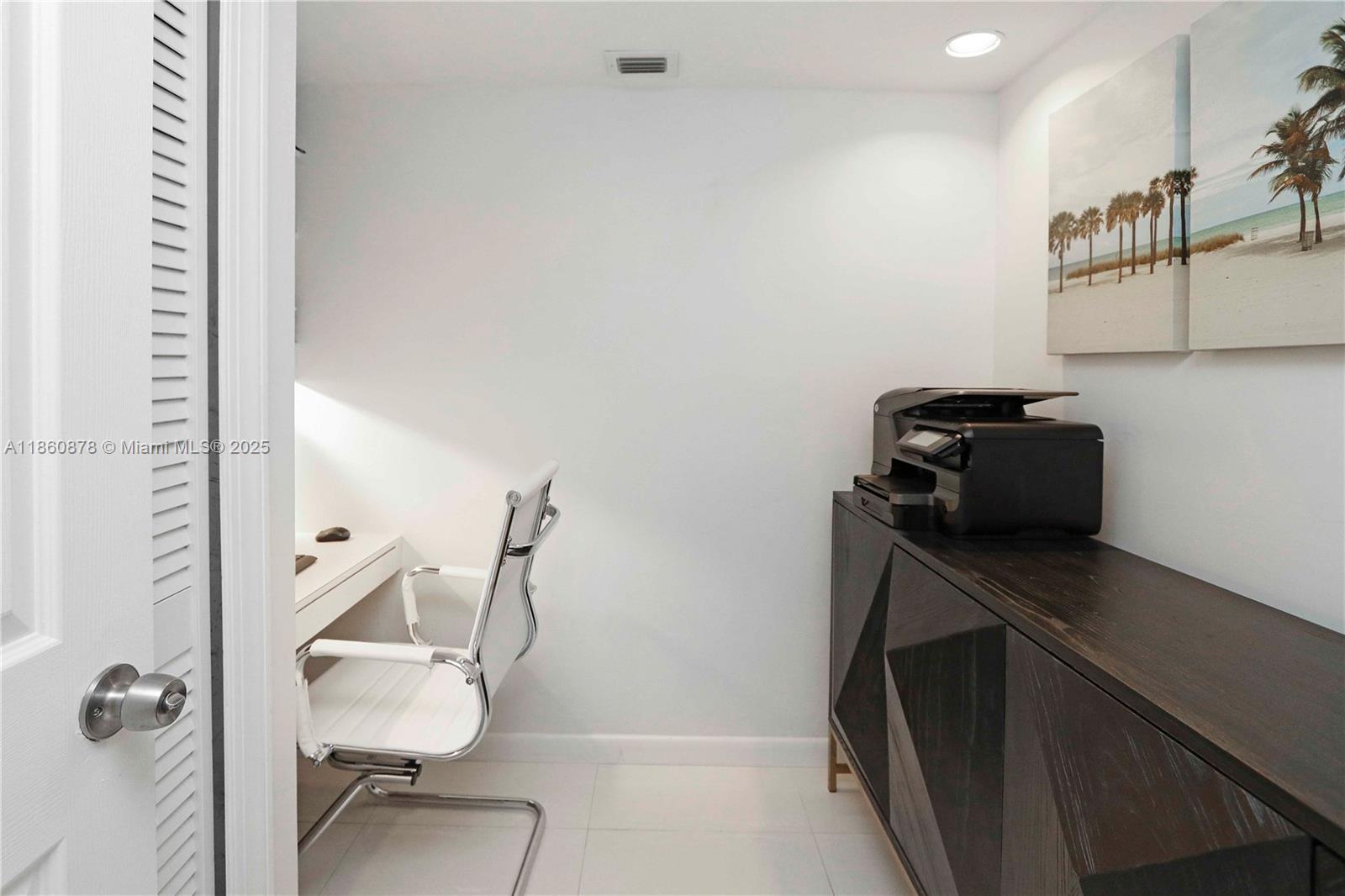 210 Seaview Drive, Unit 207 Key Biscayne, FL 33149 - Photo 11 of 24 a bathroom with a sink a toilet and mirror