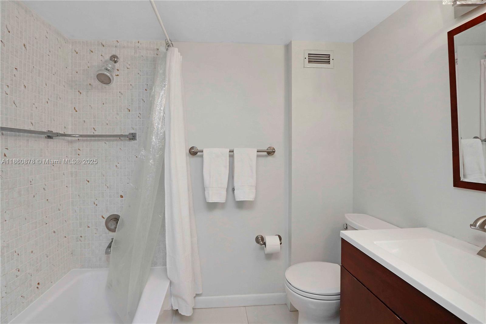 210 Seaview Drive, Unit 207 Key Biscayne, FL 33149 - Photo 15 of 24 a bathroom with a sink toilet and shower