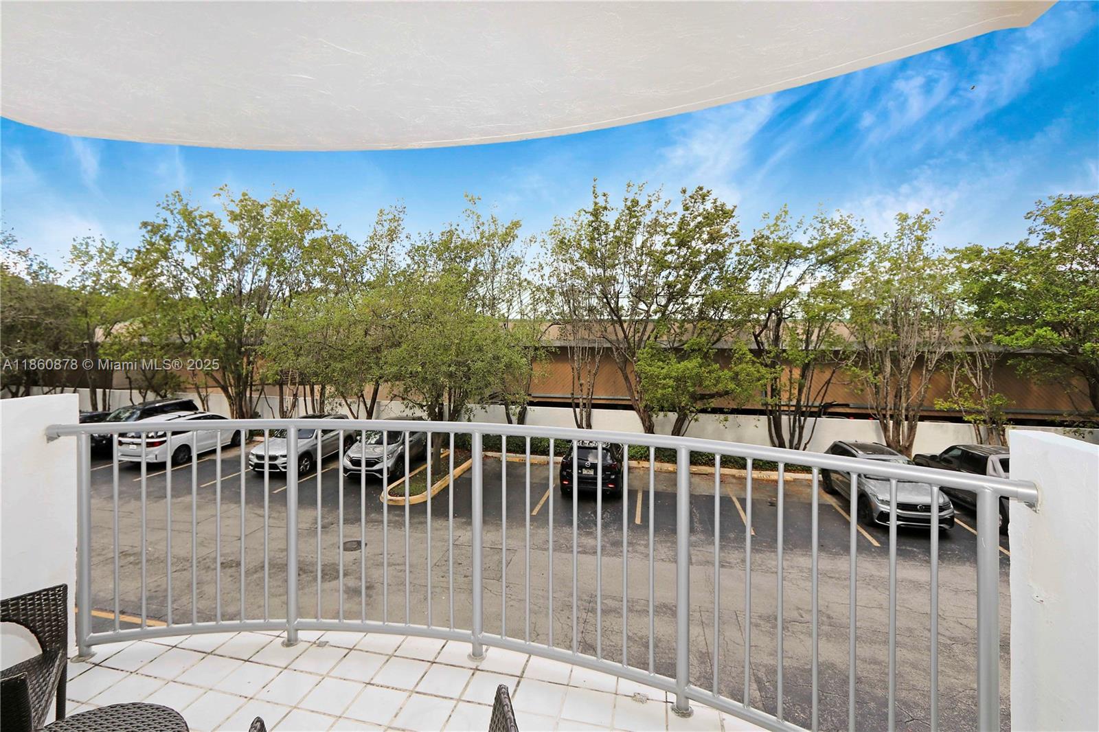 210 Seaview Drive, Unit 207 Key Biscayne, FL 33149 - Photo 16 of 24 a view of a chairs and table on the wooden floor