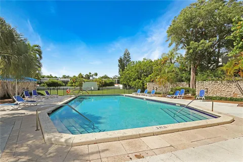 a view of swimming pool with lounge chair
