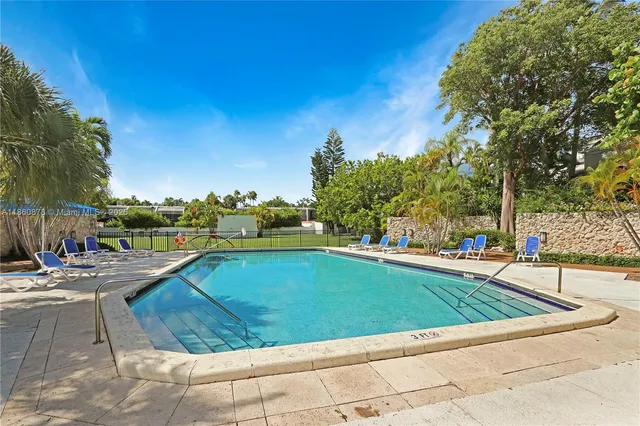 a view of swimming pool with lounge chair