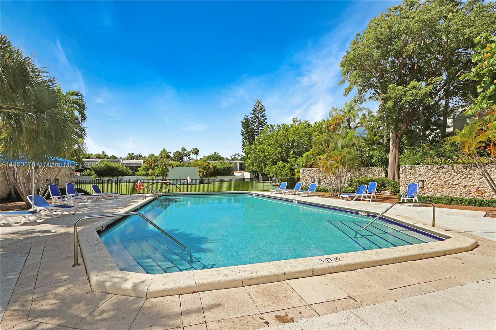 210 Seaview Drive, Unit 207 Key Biscayne, FL 33149 - Photo 20 of 24 a view of swimming pool with lounge chair